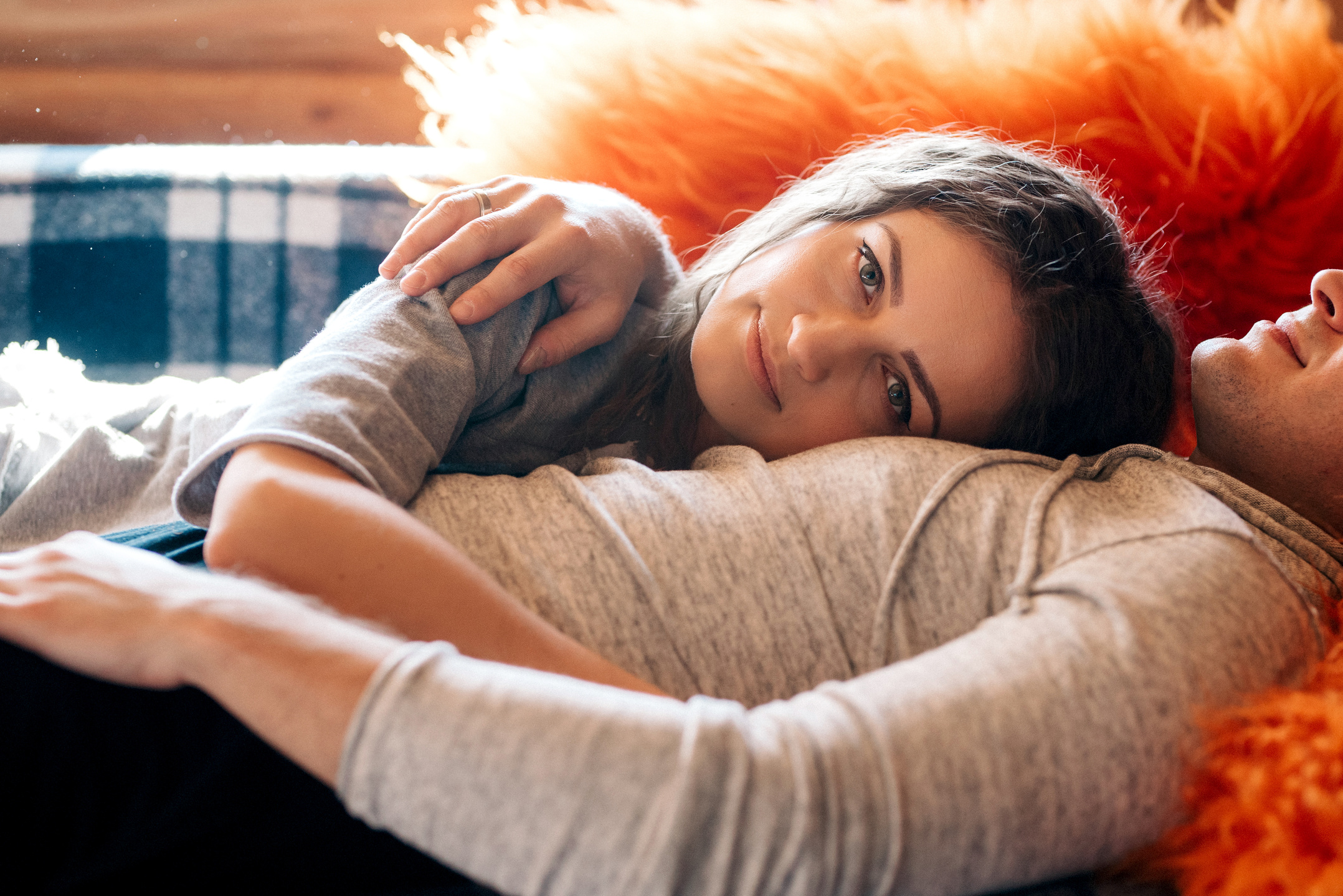 Man and Woman Cuddling on Couch at Home